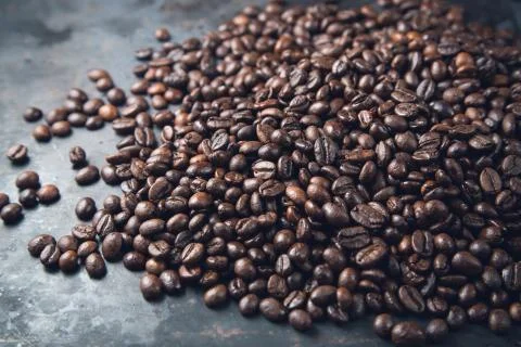 Coffee beans on rustic metal grey background Stock Photos