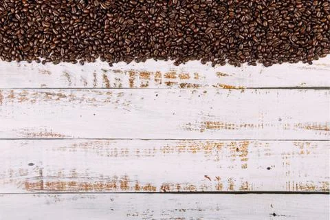 Coffee beans on rustic wood background Stockfoto's