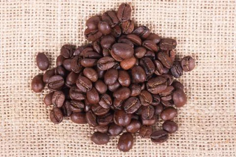 Coffee beans on sack Stock Photos