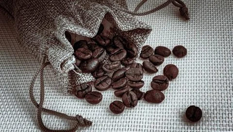 Coffee beans in a sack Stock Photos