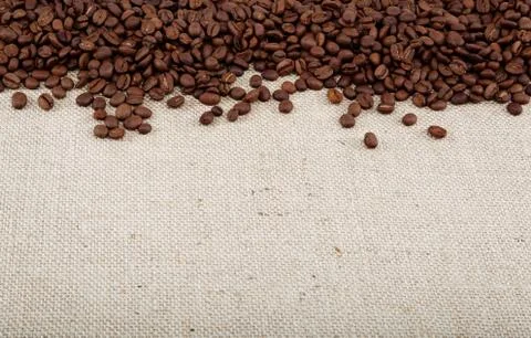 Coffee beans on sacking. Stock Photos
