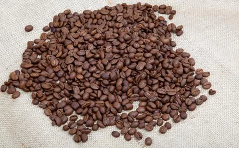 Coffee beans on sacking. Stock Photos