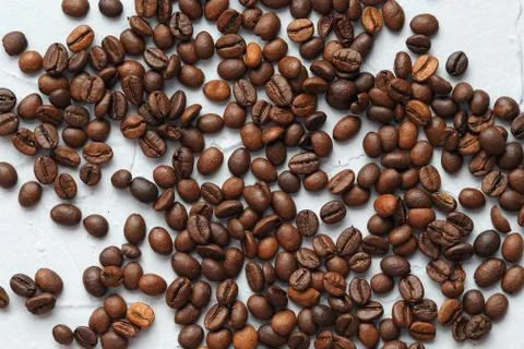 Coffee beans scattered on a gray background Stock Photos
