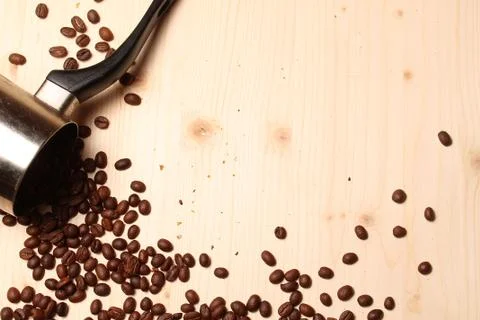 Coffee beans scattered on the table Stock Photos