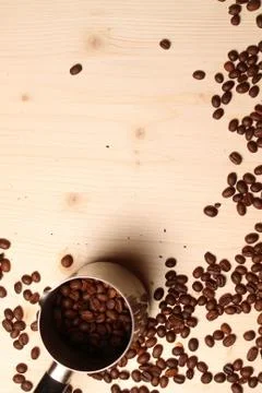 Coffee beans scattered on the table Stock Photos