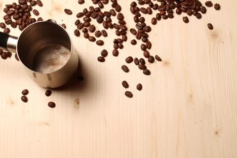Coffee beans scattered on the table Stock Photos