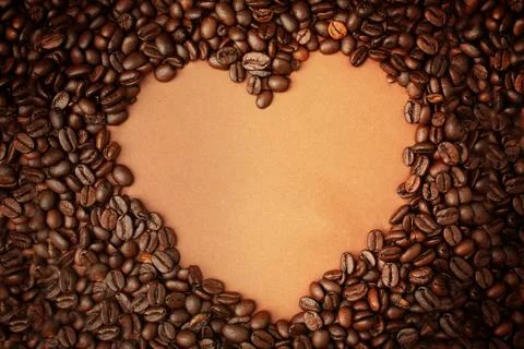 Coffee beans with shape of the heart with copy space. Top view. Stock Photos