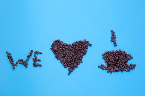 Coffee beans in shape meaning 'we love coffee' Stock Photos