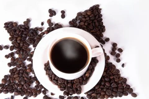 Coffee beans in the shape of a star with a cup. Stock Photos