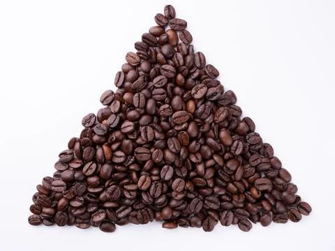Coffee beans in the shape of a triangle on a white background Stock-Fotos