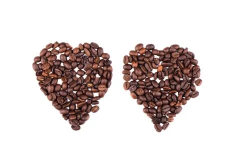 Coffee beans in the shape of two hearts. Stock Photos