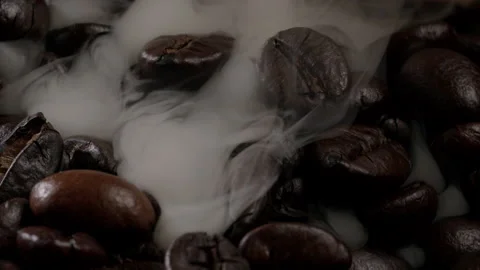 Coffee beans shrouded in smoke Stock Footage 174307786