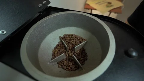 Coffee beans sinking into the grinding machine Stock Footage 235395387