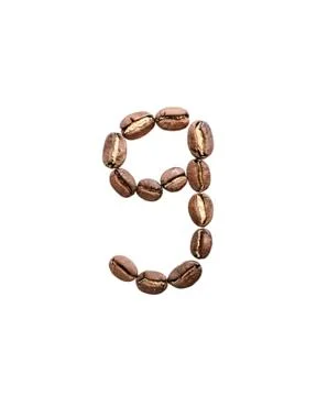 Coffee beans situated in shape of number nine. Stock Photos