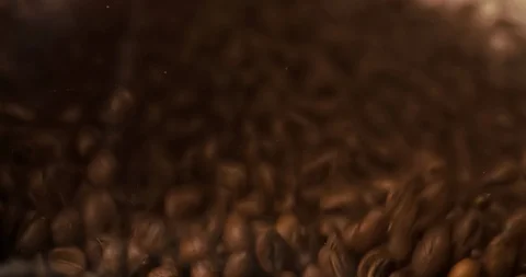 Coffee beans slow motion falling scattering and filling all screen Stock Footage 98045771