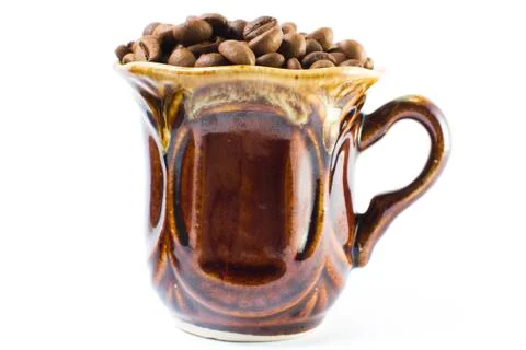 Coffee beans in a small cup on a white background. Isolated Stock Photos