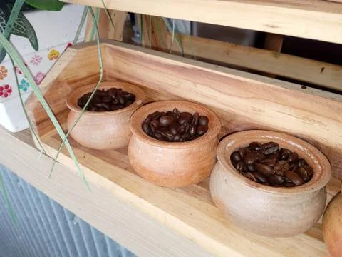 Coffee beans in small jars Stock Photos