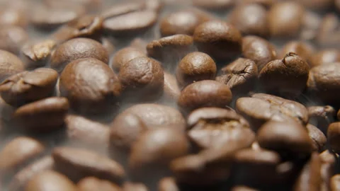 Coffee beans in smoke in 360 degree rotating showcase macro shot Stock Footage 263921767