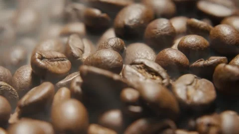 Coffee beans with smoke in 360 degree rotating showcase macro shot Video stock 271332356