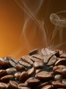 Coffee beans with smoke Stock Photos