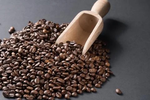 Coffee beans with a spatula Stock Photos