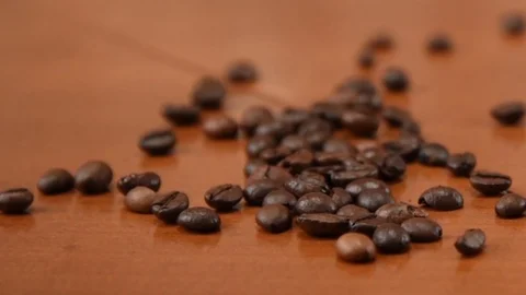 Coffee beans spilled on the table Stock Footage 90407560