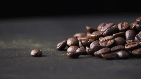 Coffee beans spin on a dark background Stock Footage 119412742