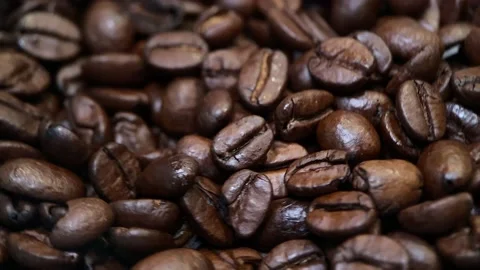 Coffee beans spinning around. Close up Stock Footage 141723033