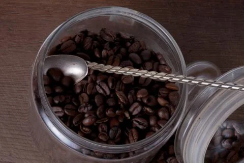 Coffee beans with a spoon Stock Photos