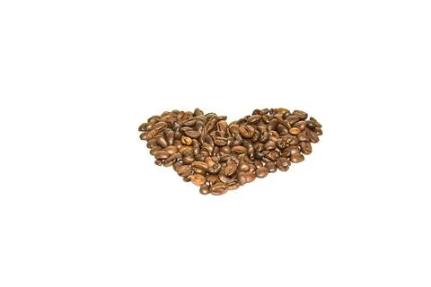 Coffee beans spread out in the shape of a heart on a white background. Isolate Stock Photos