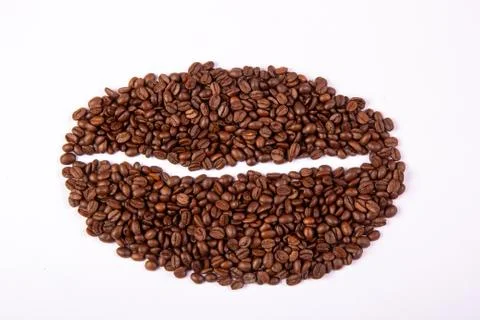 Coffee beans stacked from roasted aisle beans on white background. Stock Photos