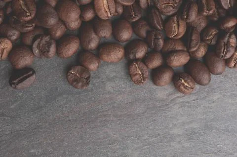 Coffee beans on stone background. 스톡 사진