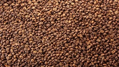 Coffee beans on the table background blurred abstract blurred Stock Photos