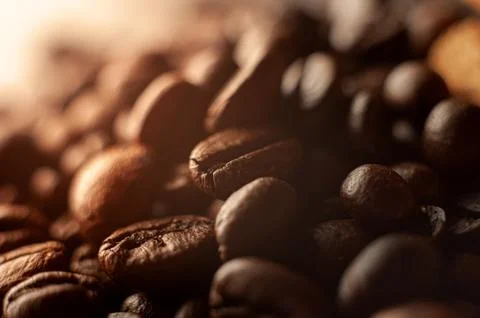 Coffee beans on the table fried with steam and hot close-up 写真素材