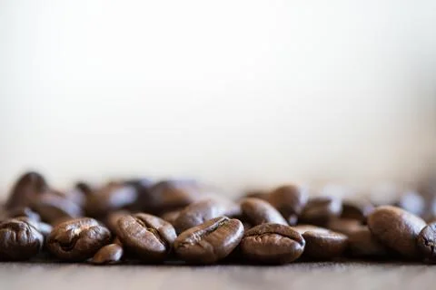 Coffee beans on table macro shot close up Stock Photos