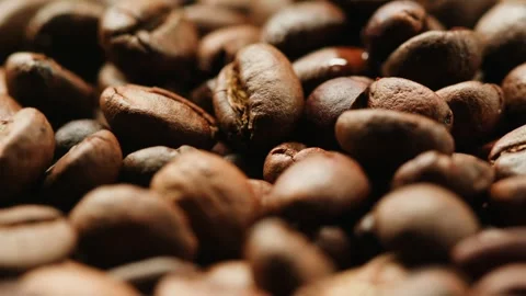 Coffee beans on table with smoke. Coffee beans close-up. Smoking, steam clouds Stock Footage 261770916