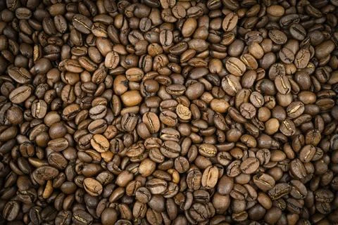 Coffee beans texture background. Brown roasted coffee beans. pattern. Close.. Stock Photos