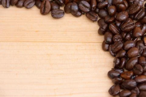 Coffee beans texture on brown background Stock Photos