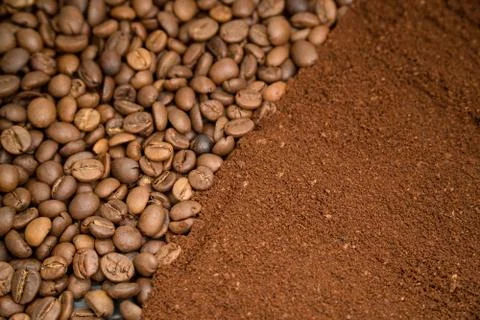 Coffee beans texture. In one half are whole grains of coffee, and in the other Stock Photos