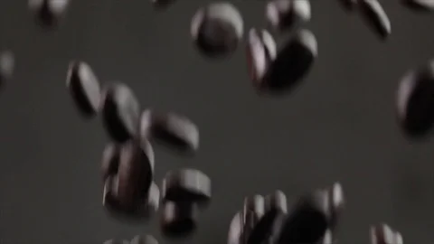 Coffee Beans Thrown Up in the Air Closeup Stock Footage 99163971