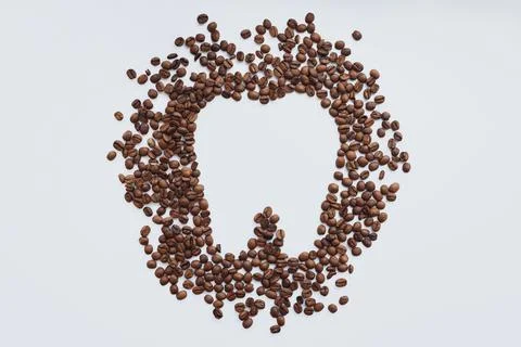 Coffee beans in tooth shape Stock Photos