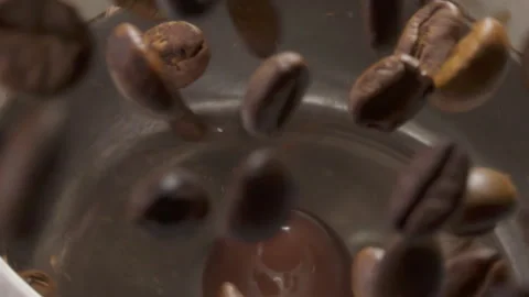 Coffee beans top-down as grinder scatters them Stock Footage 316068781