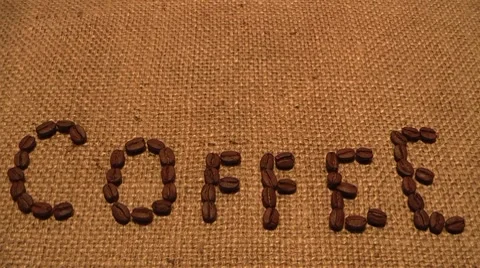 Coffee beans on traditional sack textile, kind of a background Stock Footage 8535337