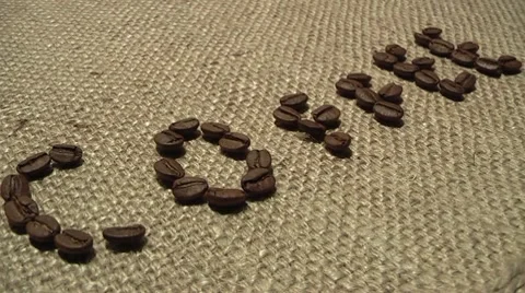 Coffee beans on traditional sack textile, kind of a background Stock Footage 8535375