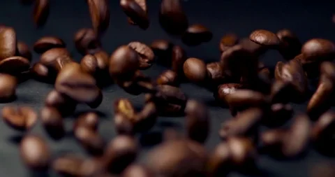 Coffee Beans Tumbling Towards the Camera Stock Footage 105879079