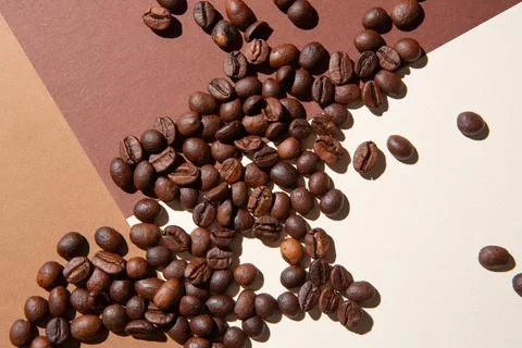 Coffee beans viewed from above on a background of different colors Stock Photos