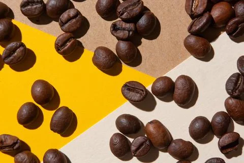 Coffee beans viewed from above on a background of different colors Stock Photos