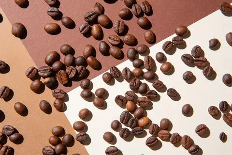 Coffee beans viewed from above on a background of different colors Stock Photos