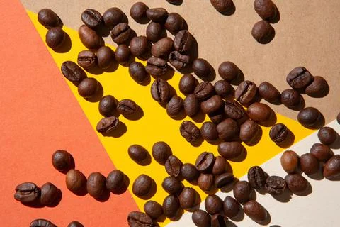 Coffee beans viewed from above on a background of different colors Stock Photos