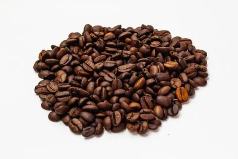 Coffee beans on the white background Stock Photos